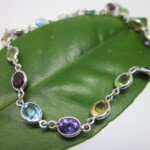 K18WG Semi-precious stone, Blue topaz, Amethyst, Peridot & Garnet Bracelet